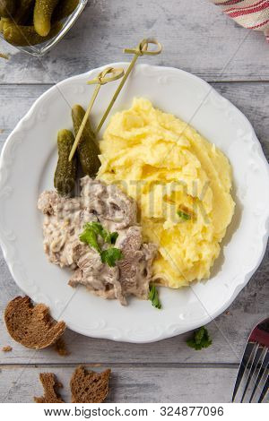 Beef Stroganoff, Traditional Russian Dish Of Goulash With Beef In Creamy Sauce, Mashed Potatoes And