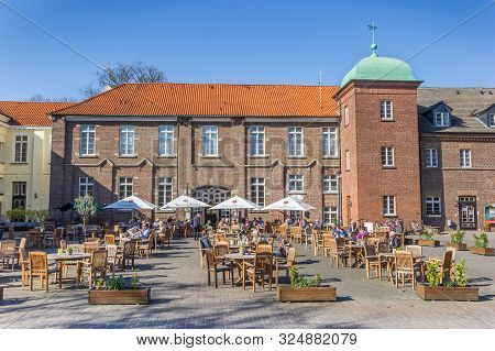 Herten, Germany - April 01, 2019: People Enjoying The Sun At The Castle In Westerholt, Germany