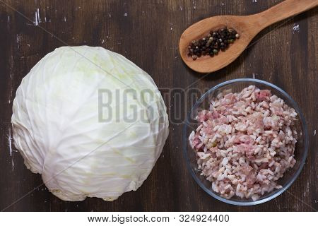 Top View Of Cabbage And Meat With Rice Stuffing For Stuffed Cabbage On Brown Background