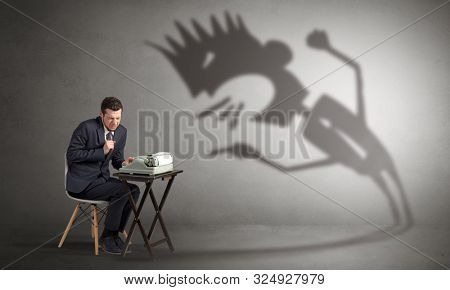Man working hard and he is afraid of a yelling shadow