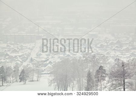 Scenic Winter Landscape Background. View Of The Snow-covered Town, Houses And Trees.