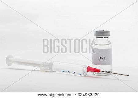Medical Concept Showing Medical A Medical Vial Reading Deca And A Syringe