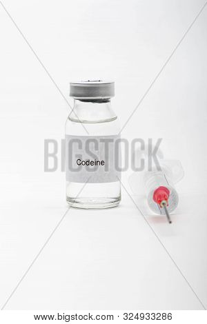 Medical Concept Showing Medical A Medical Vial Reading Codeine And A Syringe