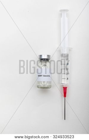Medical Concept Showing Medical A Medical Vial Reading Mmr Vaccine With A Syringe
