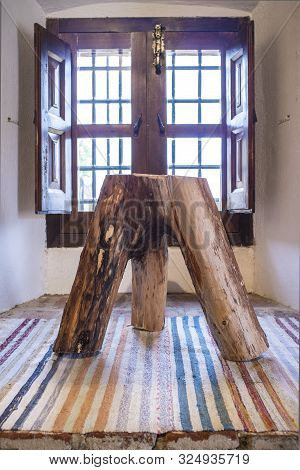 Three Legs Stump Stool Made With Tree Trunk And Main Branches. Rustic Home Design