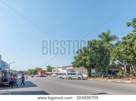 Phalaborwa, South Africa - May 18, 2019: A Street Scene, With Businesses, Vehicles And People, In Ph