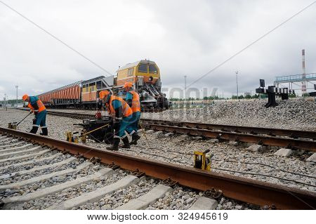 Tobolsk, Russia - July 15. 2016: Sibur Company. Denisovka Railway Station. Railway Workers Repairing