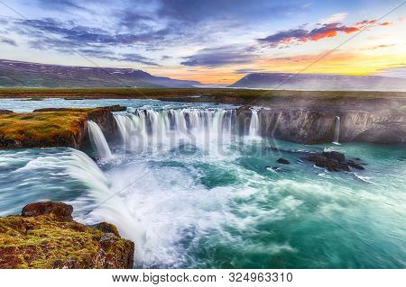 Fantastic Sunset Scene Of Powerful Godafoss Waterfall. Dramatic Sky Over Godafoss. Location: Bardard