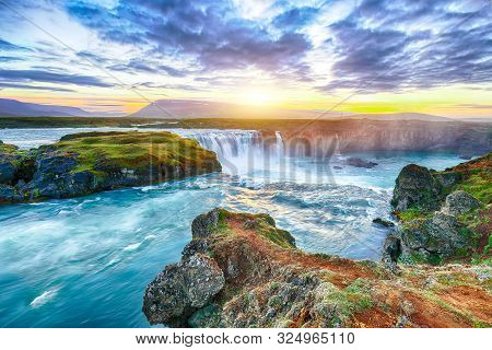 Fantastic Sunset Scene Of Powerful Godafoss Waterfall. Dramatic Sky Over Godafoss. Location: Bardard