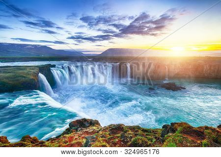 Fantastic Sunset Scene Of Powerful Godafoss Waterfall. Dramatic Sky Over Godafoss. Location: Bardard