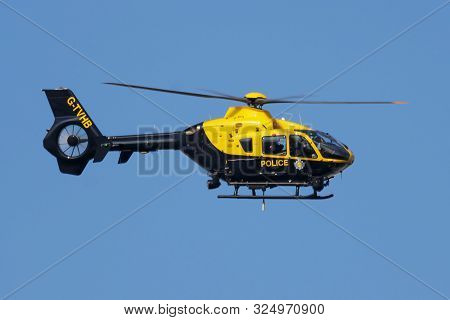 London / United Kingdom - July 14, 2018: Metropolitan Police Eurocopter Ec-135 Helicopter Flying At 