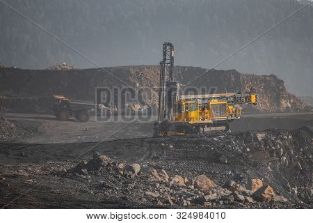 Open Mine Coal And Minerals From Bowels Soil Explosion. Drilling Rigs Borer Drill Wells For Installi