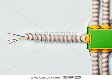 Electrical Work. Connection Of An Electric Wire To A Wall-mounted Junction Box, Rectangular, Made Of