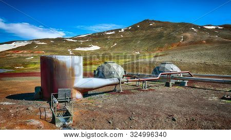 Icelandic Landscape With Geothermal Power Plant Station And Pipes. Borehole Well Of Krafla Power Sta