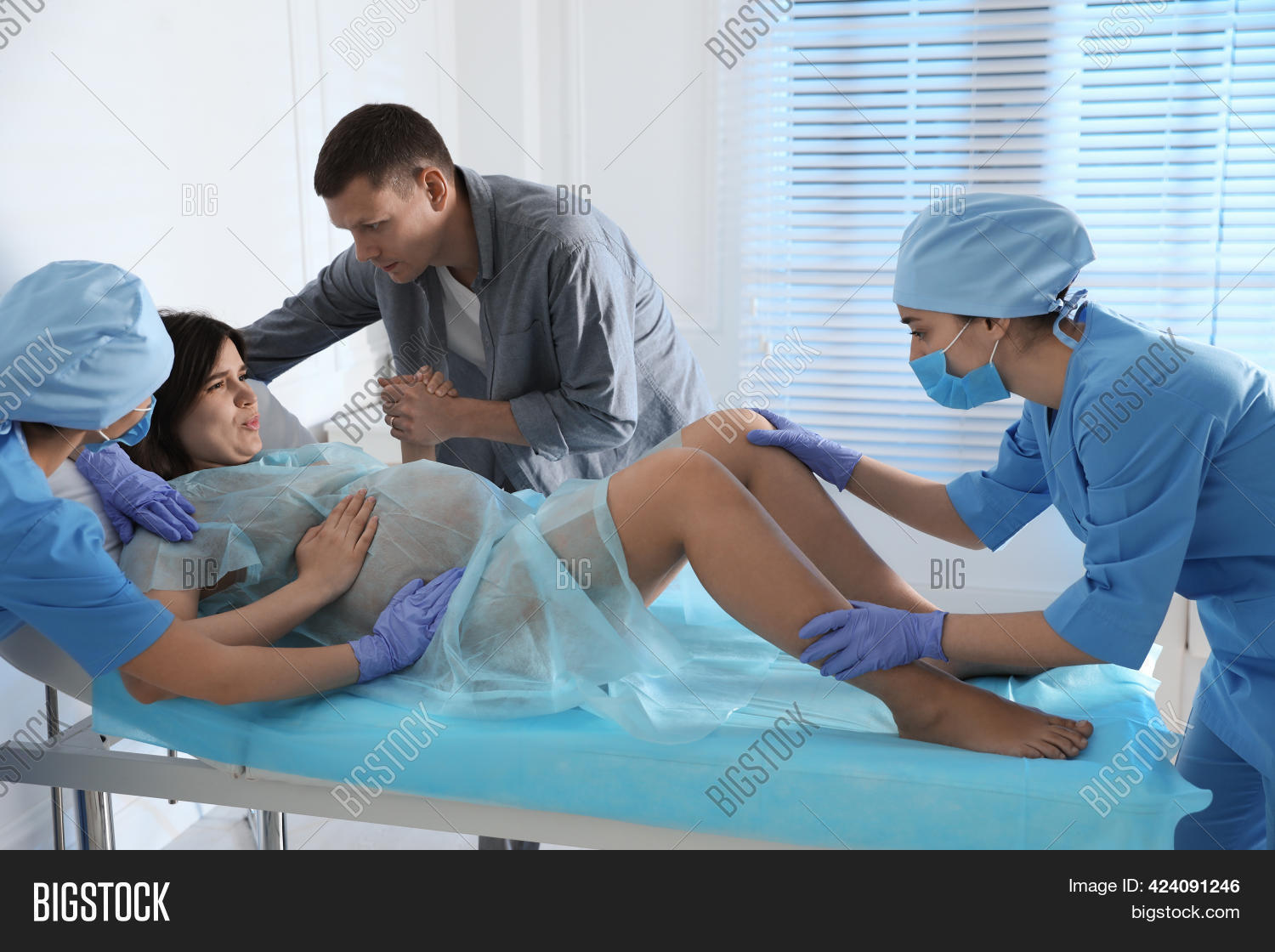 a woman giving birth in a hospital