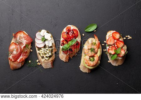 Appetizers board with traditional spanish tapas set. Italian antipasti brushetta snacks. Top view flat lay