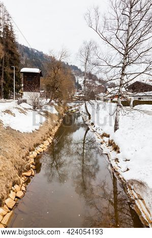 Bruck Winter Landscape.  A Stream Flows Through The Village Of Bruck An Der Grossglocknerstrasse In 