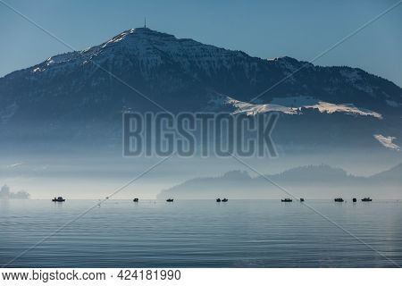 Splendid Zugersee (Lake Zug) on a spring day with snowy Alpine peaks in the background