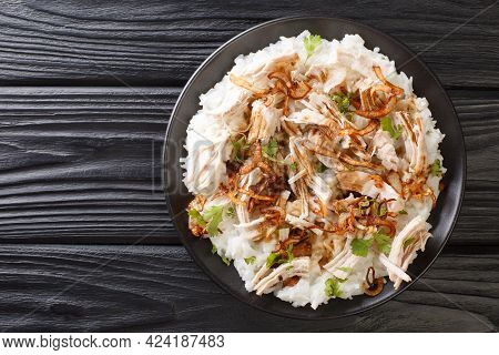 Turkey With Rice And Fried Onions Close-up In A Plate On The Table. Horizontal Top View From Above