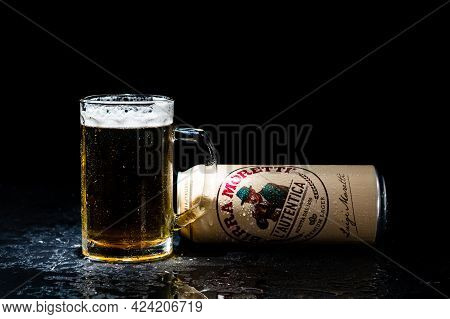 Can Of Birra Morreti Beer And Beer Glass On Dark Background. Illustrative Editorial Photo Shot In Bu