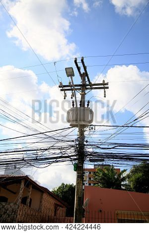 Salvador, Bahia, Brazil - June 18, 2021: Transformer Is Seen Along Exposed Wires In Electric Network