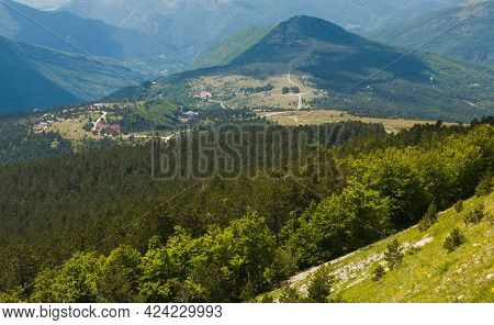Panoramic View Of Frontignano Village Surrounded By Green Forest In The National Park Of Monti Sibil