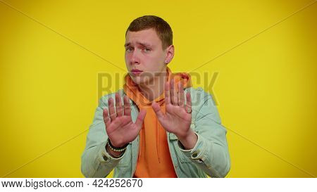 Hey You, Be Careful. Teenager Boy In Denim Jacket Warning With Admonishing Finger Gesture, Saying No
