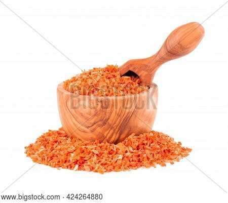 Dry Carrot In Olive Bowl And Scoop, Isolated On The White Background. Chopped Dried Carrot. And Herb