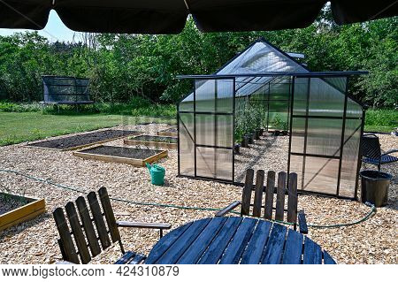 Greenhouse Table And Chairs With Sunshade In Garden