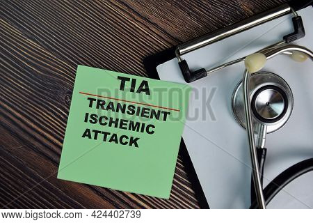 Tia - Transient Ischemic Attack Write On Sticky Notes Isolated On Wooden Table. Medical Concept