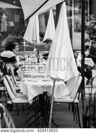 Strasbourg, France - May 19, 2021: Side View Of Young People Eating Outside At Maison Kammerzell Ico