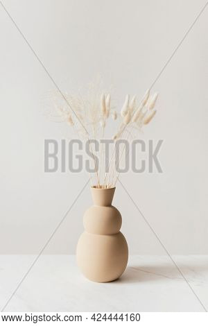 Dried Bunny Tail grass in abrown vase