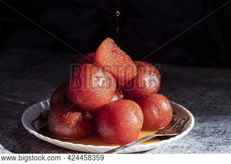 Indian Sweets - Gulab Jamun In Plate On Dark Background