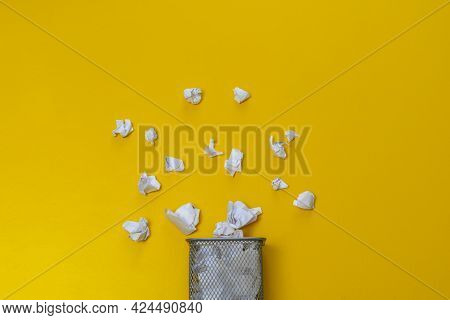 Bunch Of Crumpled Paper Balls In The Metal Rubish Bin Urn Basket On The Colorful Background