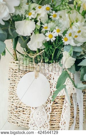 Wooden basket of white flowers