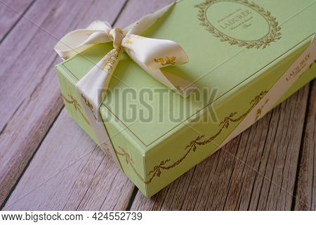 Nice, France - 18.06.2021: Famous French Macaroons From Laduree Store. A Green Special Gift Box On A