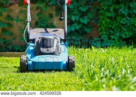 Lawnmower Electric Machine Trimming Green Grass. Lawn Cutting