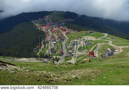 Beautiful scenic view in a rainy and cloudy day over the Transalpina road, the highest mountain road in the Carpathians located in the Parang mountains, Romania, Europe