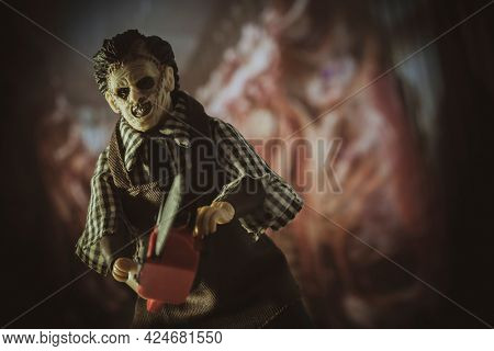 JUNE 23 2021: Scene from Texas Chainsaw Massacre, killer Leatherface hunts victims with his chainsaw  - Mego Corp action figure