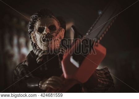 JUNE 23 2021: Scene from Texas Chainsaw Massacre, killer Leatherface hunts victims with his chainsaw  - Mego Corp action figure