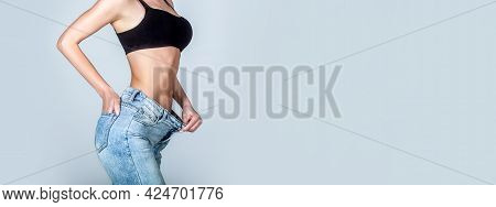 Woman Showing Slim Body After Sport Trainings, Healthy Eating. Weight Loss Concept. Thin Woman In Bi