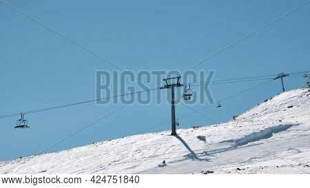 Ropeway On The Slope Of Erciyes Mount Covered By Cloud. Snow Covered Top Of Erciyes Stratovolcano. E