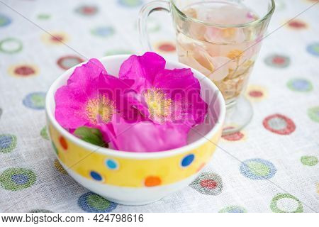 Rugosa Rose (rosa Rugosa, Japanese Rose) Flowers In The Bowl And Herbal Rose Tea.