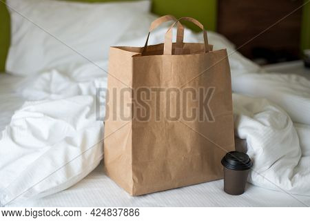 Delivery Food Craft Bag With Cup On The Bed On Sunny Day. Delivery In Any Weather Around The Clock T