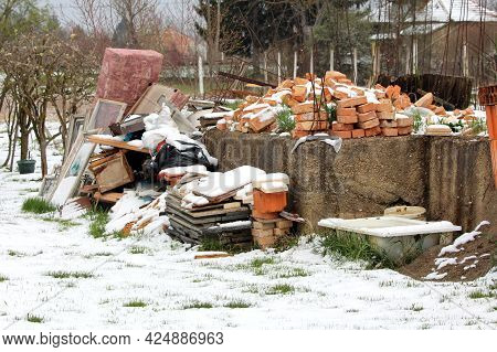 Bunch Of Various Junk From Construction Material Made Of Bricks And Bathtub To Broken Windows And Ol