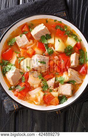 Marmitaco Fish And Potato Stew Spanish Cuisine Closeup In The Plate On The Table. Vertical Top View 