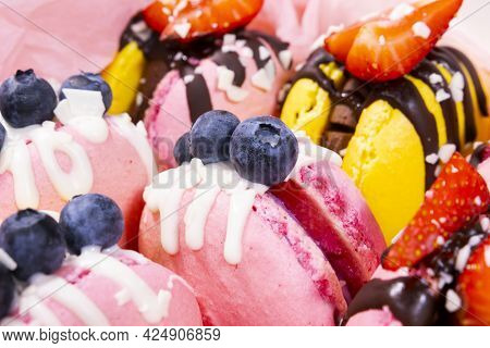 Traditional French Macaroons With Bluebarry And Strawberry. Colourful And Delicious Dessert With Cho