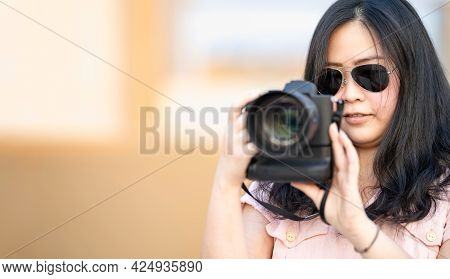 Amateur Sunglasses Asian Woman Take A Photo With Professional Mirrorless Camera At Outdoor Blue Roof