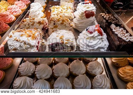 Tasty Sweets In Window Of Confectionery Store. Fresh Pastries, Donuts, Cakes