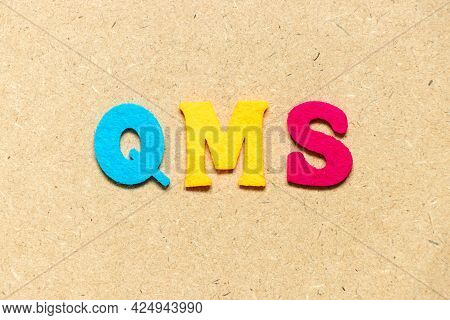 Color Cloth Alphabet Letter In Word Qms (abbreviation Of Quality Management System) On Wood Backgrou